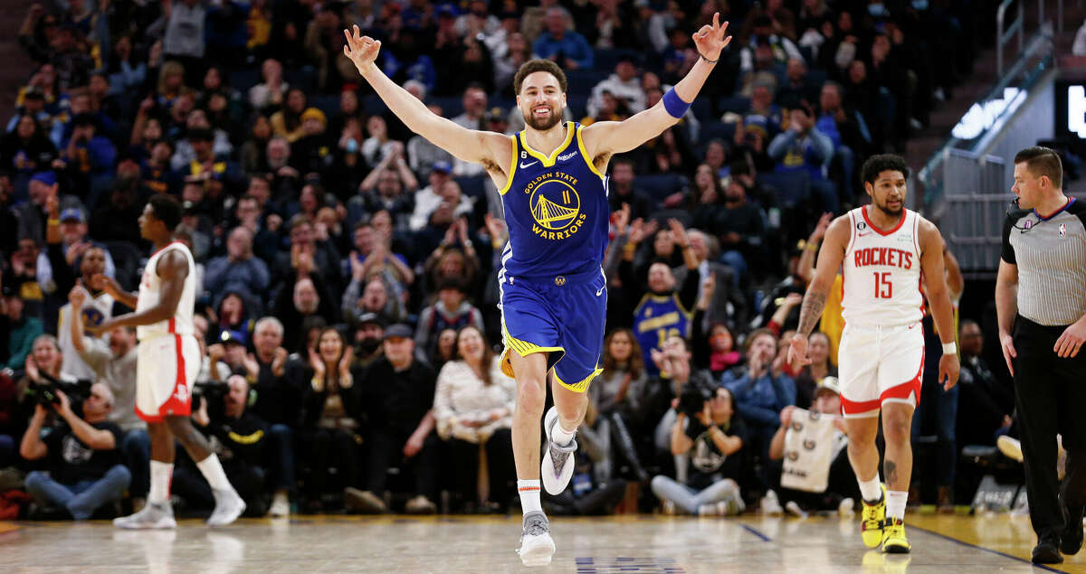 Golden State Warriors guard Klay Thompson (11) celebrates after scoring a three-point shot against Houston Rockets guard Daishen Nix (15) in the fourth quarter during an NBA game at Chase Center in San Francisco, Calif., Friday, Feb. 24, 2023. The Warriors won 116-101.