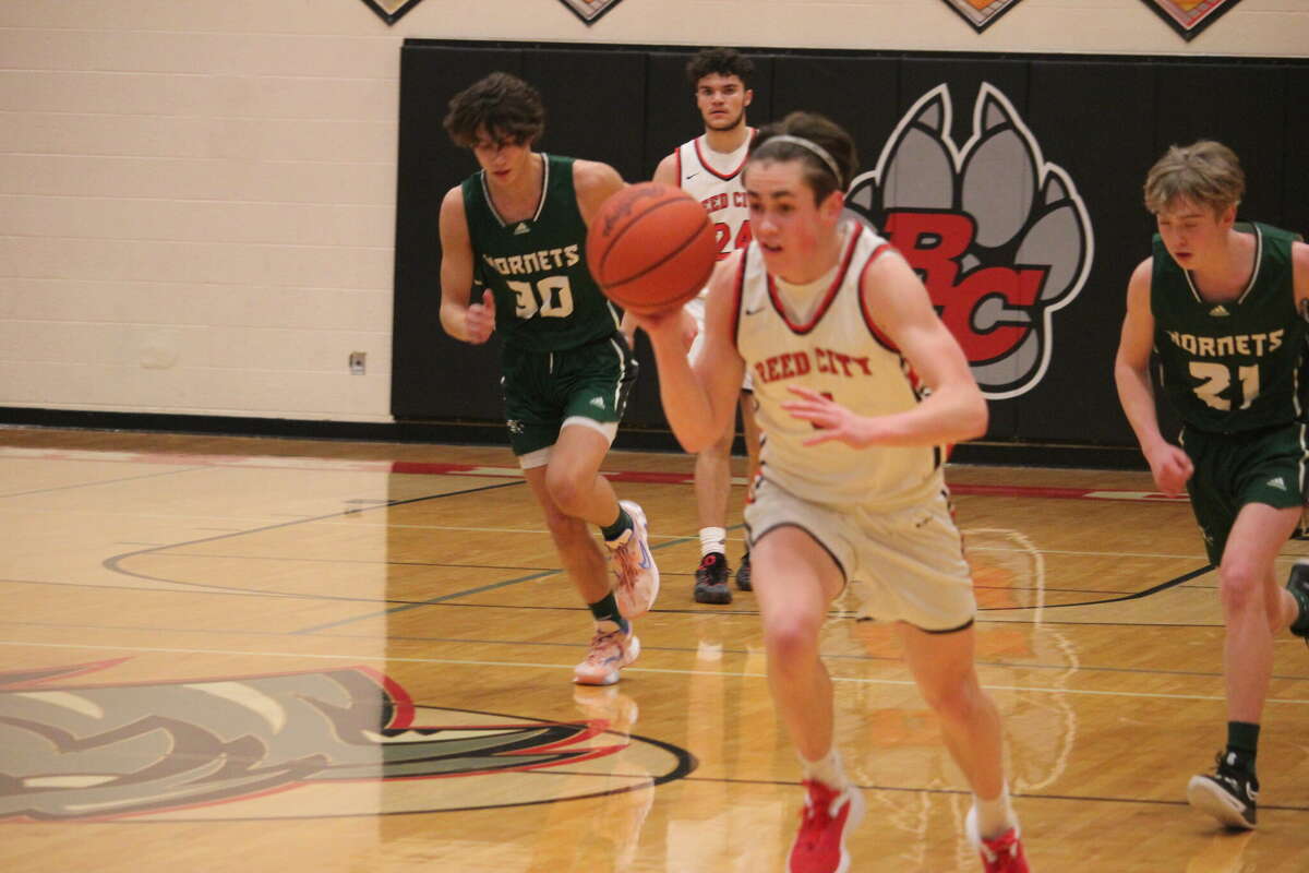 Reed City's Aiden Storz dribbles down the court against Central Montcalm on Friday.