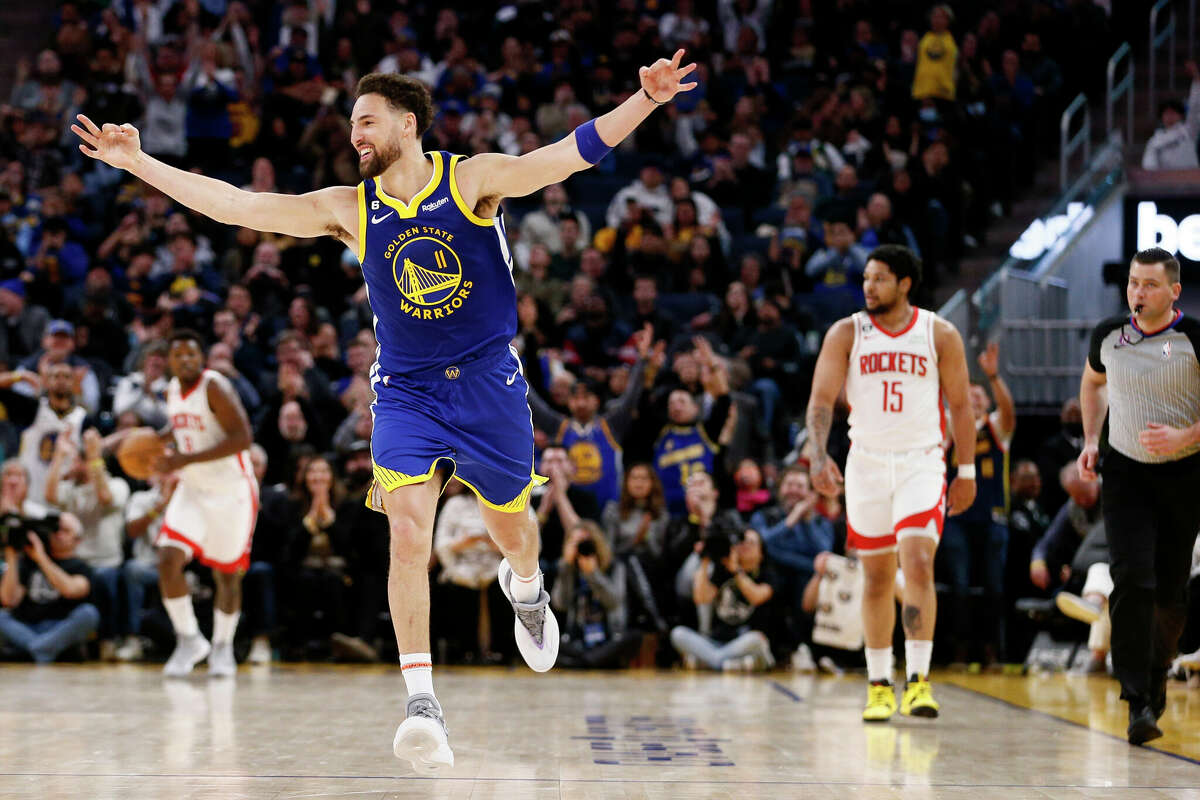 Golden State Warriors guard Klay Thompson (11) celebrates after scoring a three-point shot against Houston Rockets guard Daishen Nix (15) in the fourth quarter during an NBA game at Chase Center in San Francisco, Calif., Friday, Feb. 24, 2023. The Warriors won 116-101.