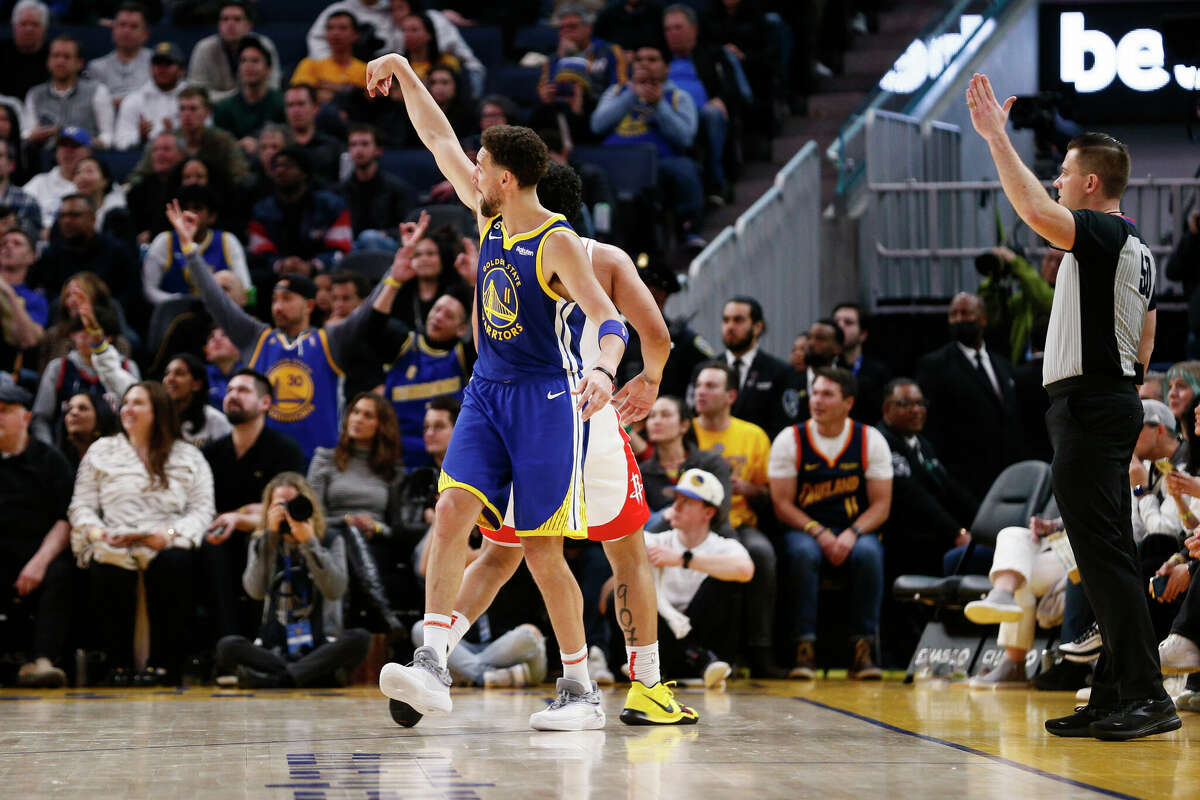 Golden State Warriors guard Klay Thompson (11) scores a three-point shot in the fourth quarter during an NBA game against the Houston Rockets at Chase Center in San Francisco, Calif., Friday, Feb. 24, 2023. The Warriors won 116-101.
