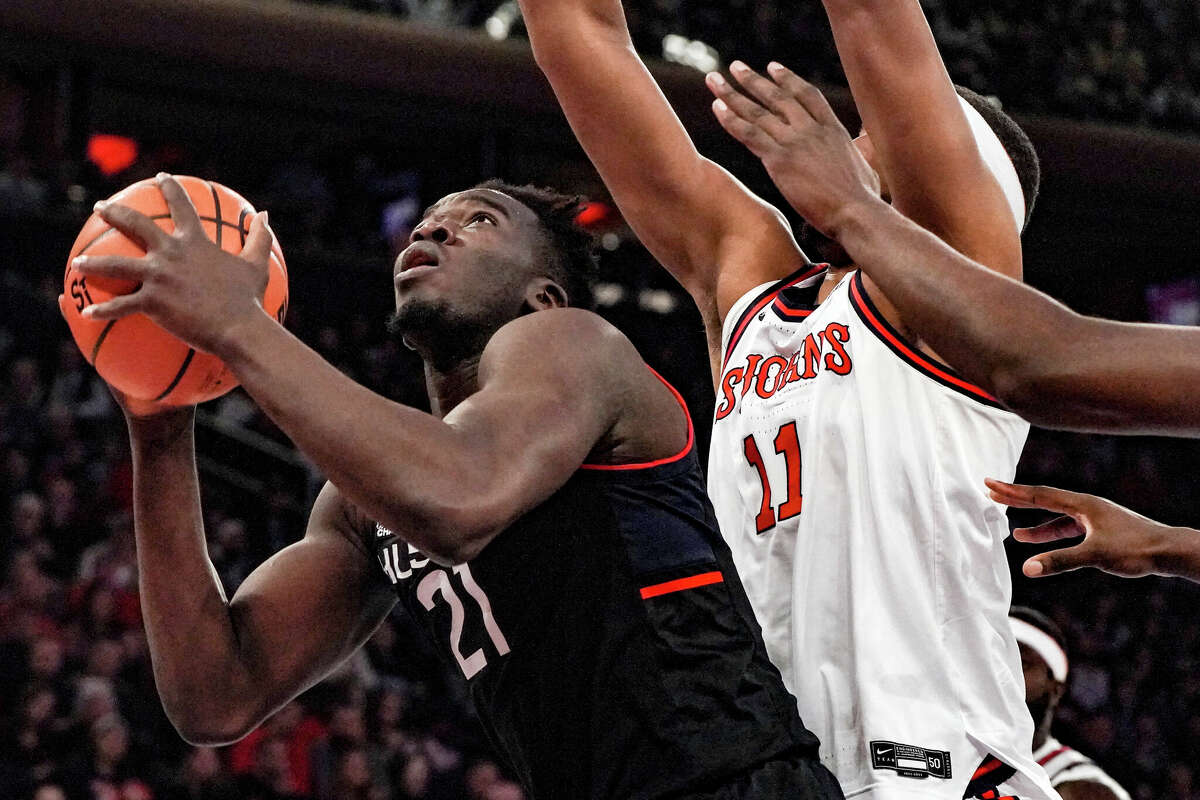 UConn forward Adama Sanogo goes for a basket during the first half of an NCAA college basketball game against St. John's, Saturday, Feb. 25, 2023, in New York. (AP Photo/Bebeto Matthews)