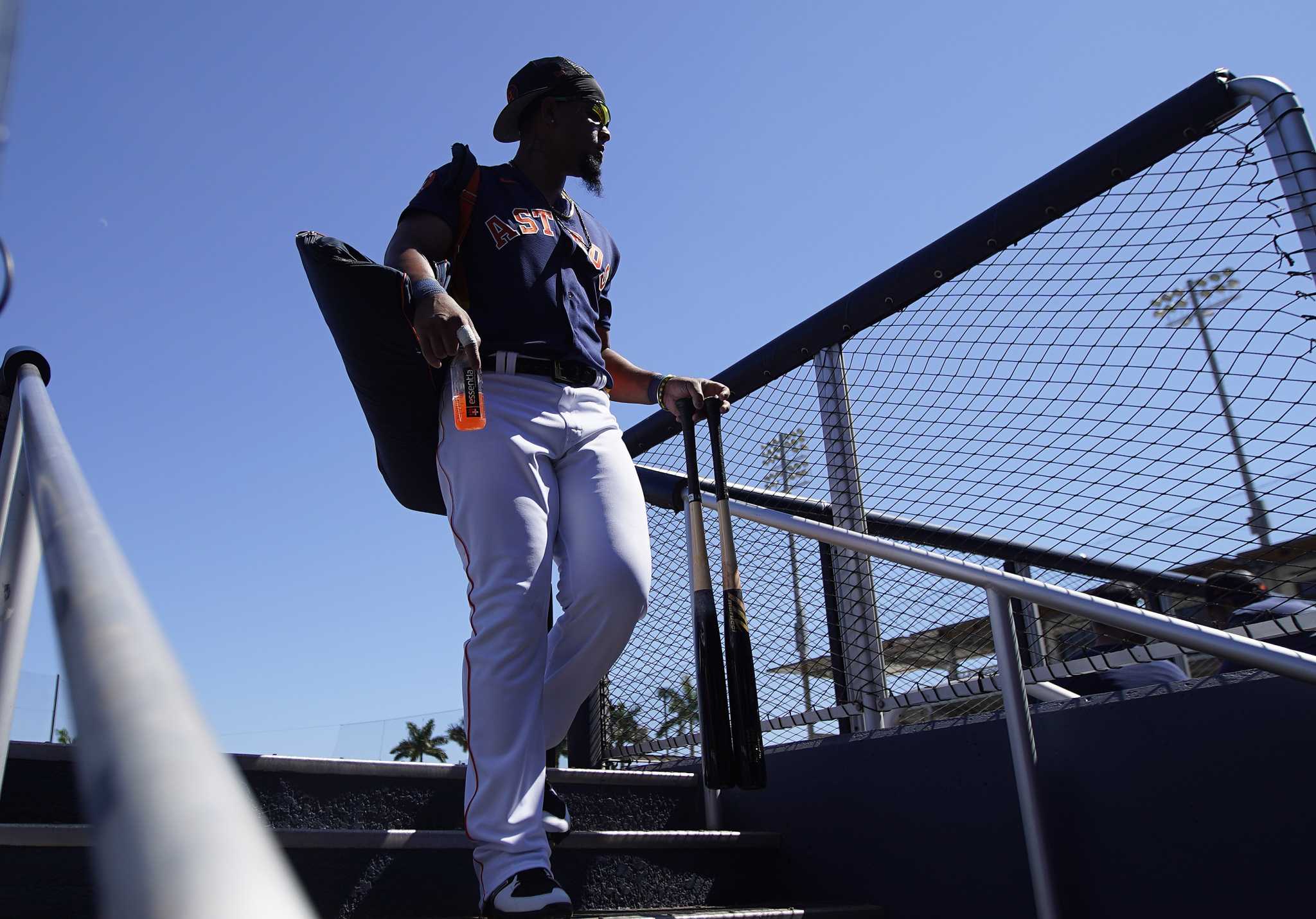 Houston Astros first baseman Jose Abreu (79) wipes sweat during