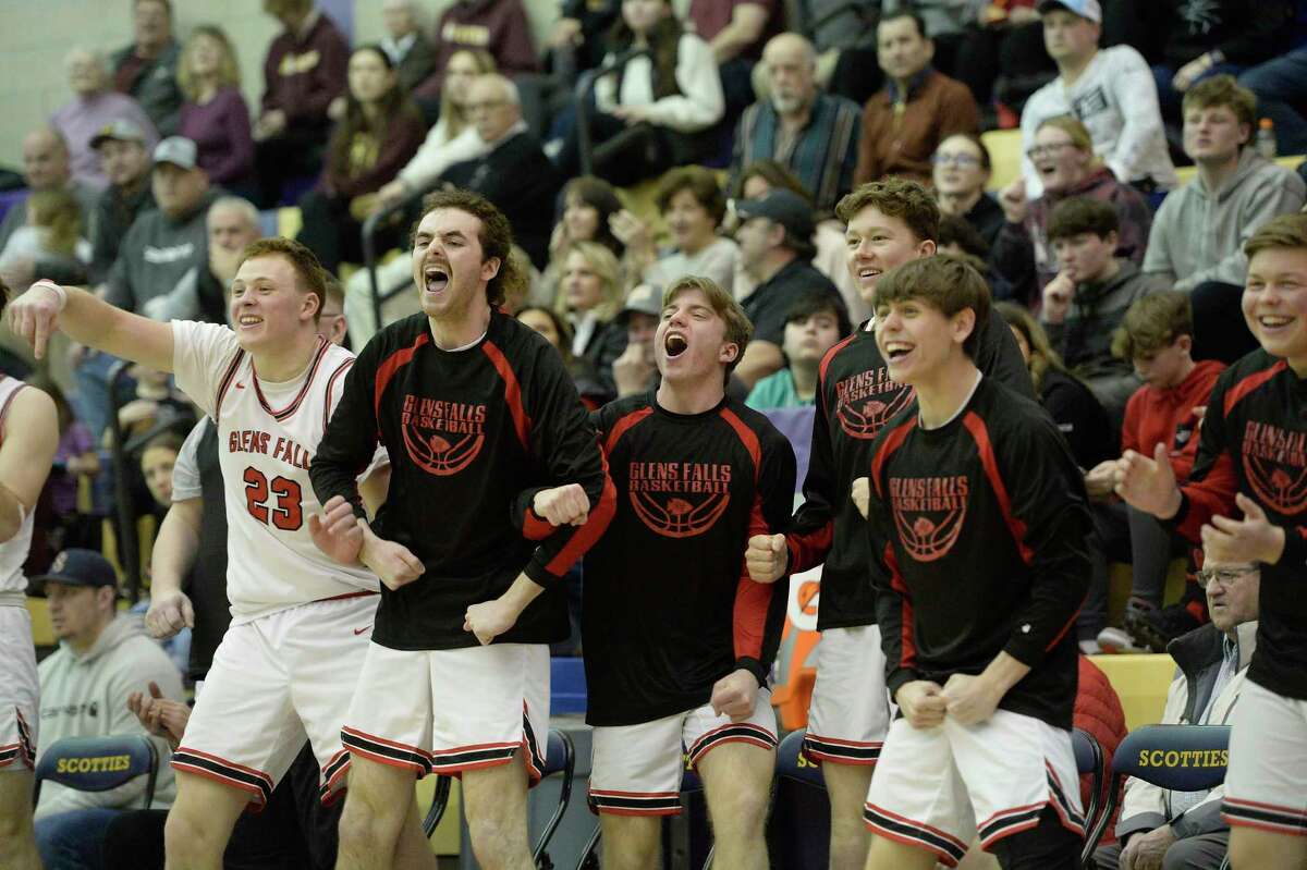Glens Falls basketball players react to a basket made on the court against Schalmont during their Class B semifinal at Ballston Spa High School on Saturday, Feb. 25, 2023, in Ballston Spa, N.Y. (Jenn March, Special to the Times Union)