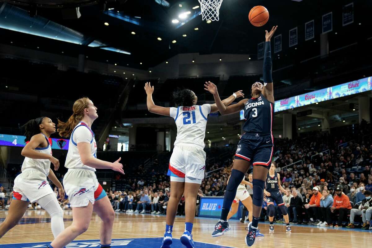 UConn forward Aaliyah Edwards, right, makes a shot as DePaul guard Darrione Rogers tries to block her during the first half of an NCAA college basketball game Saturday, Feb. 25, 2023, in Chicago. (AP Photo/Erin Hooley)