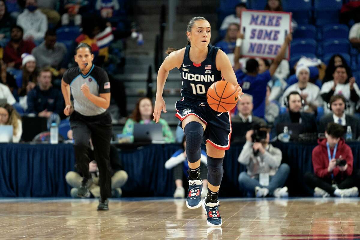 UConn guard Nika Muhl dribbles the ball during the first half of an NCAA college basketball game against DePaul, Saturday, Feb. 25, 2023, in Chicago. (AP Photo/Erin Hooley)