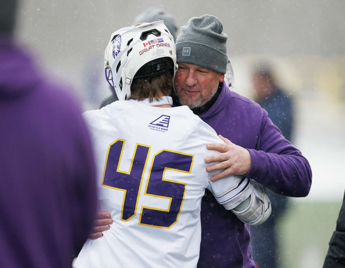 UAlbany men's lacrosse coach Scott Marr celebrates his 200th career victory with Graydon Hogg. The Danes defeated Drexel 11-7 at Casey Stadium on Saturday, Feb. 25, 2023.