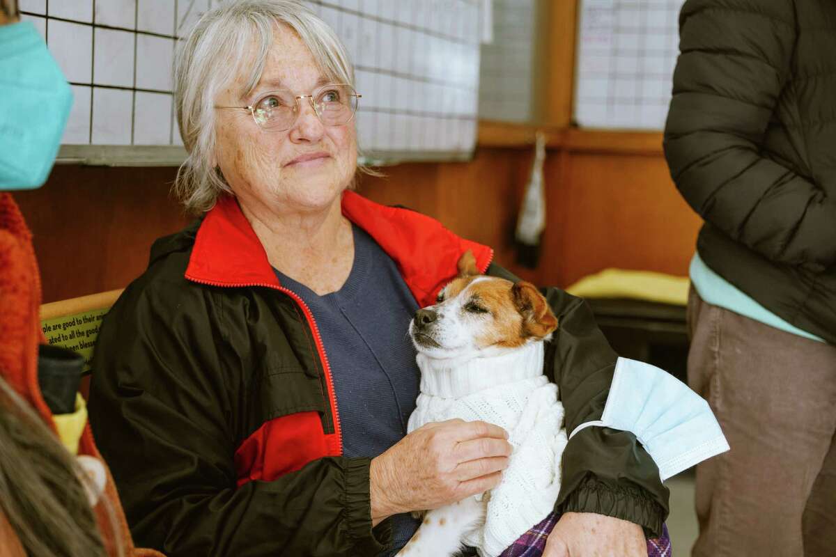 Lorrie Verplaetse holds her newly adopted dog who’s 14 years old and named Thank You at Muttville on Alabama street in San Francisco, Calif., on Saturday, Feb. 25th, 2023.