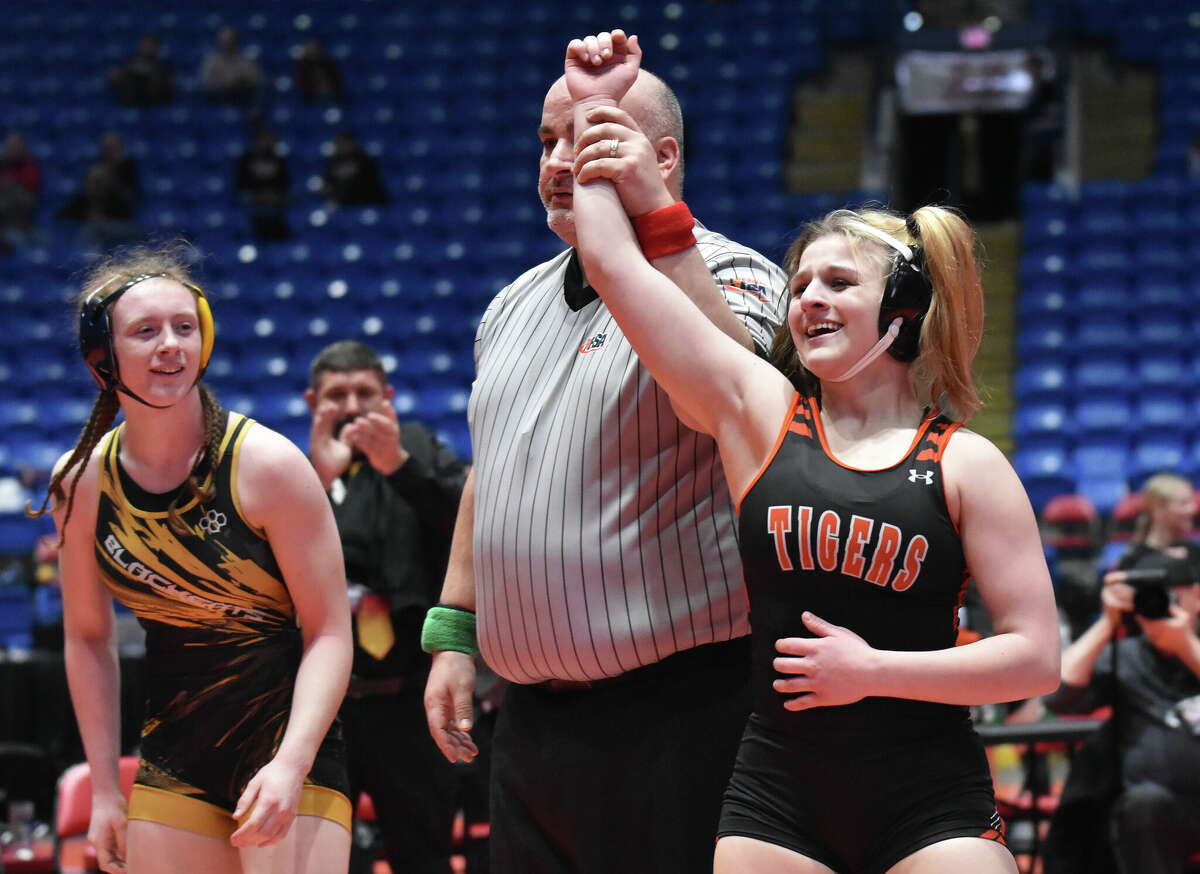 Edwardsville High School sophomore Mackenzie Pratt, right, became the girls wrestling program's first state champion when she pinned Goreville's Alivia Ming in 1:07 in the 140-pound championship match at the state tournament on Saturday inside Grossinger Motors Arena in Bloomington. For reaction and more photos, please see sports editor Matt Kamp's story on B1.