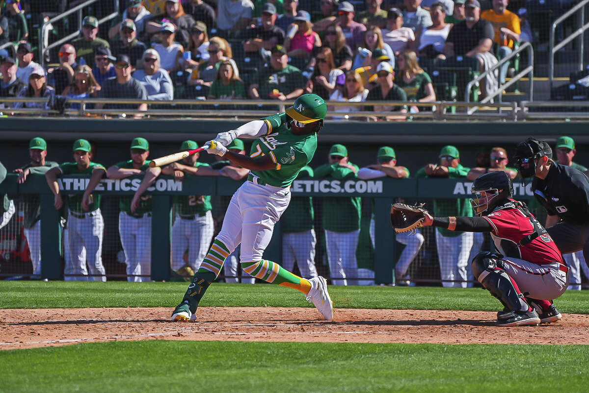 Oakland Athletics outfield prospect Lawrence Butler hits during the team's Feb. 25 Cactus League opener against the Arizona Diamondbacks at Hohokam Stadium. Butler had a two-run double in the fifth inning.