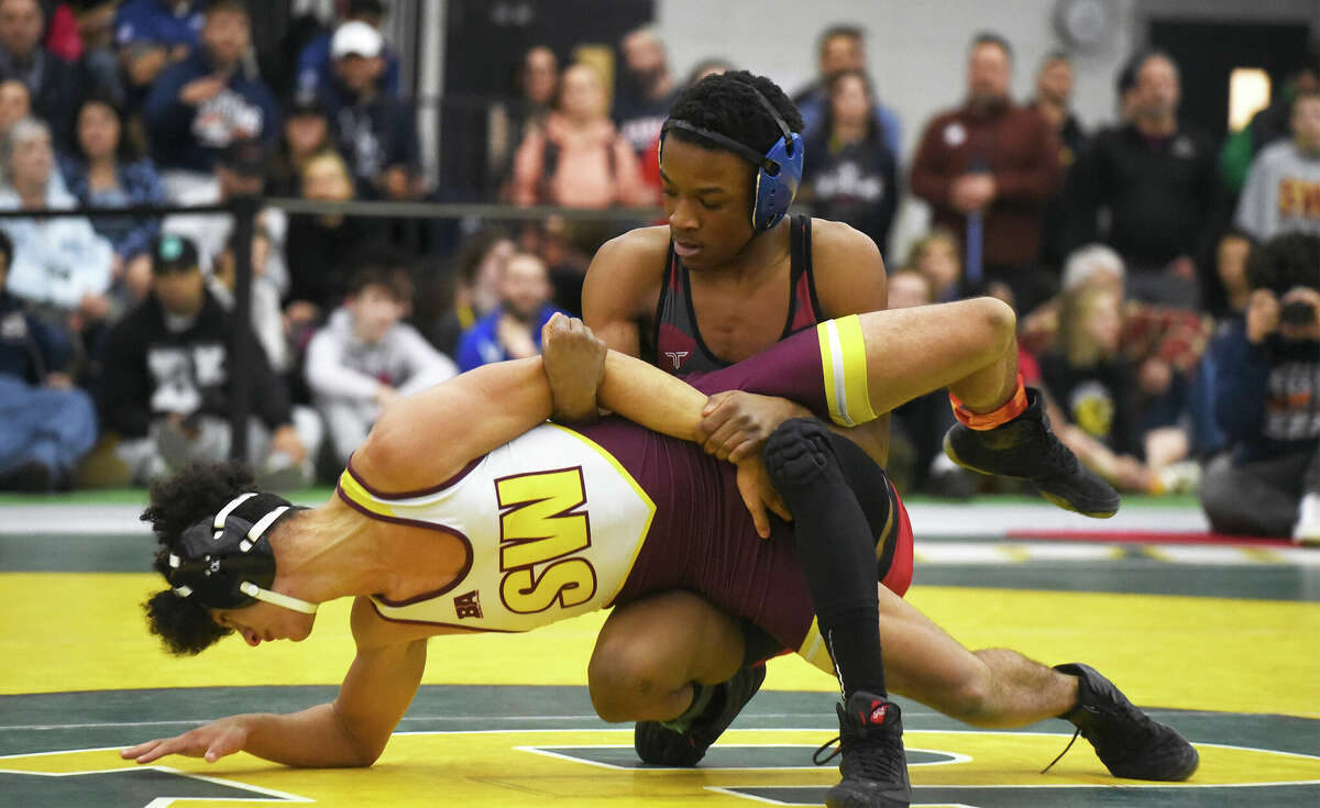 Avon's Isaiah Adams controls South Windsor's Kyden Merlin during the 113-pound weight class final at the CIAC State Open wrestling championships in New Haven on Saturday, Feb. 25, 2023.