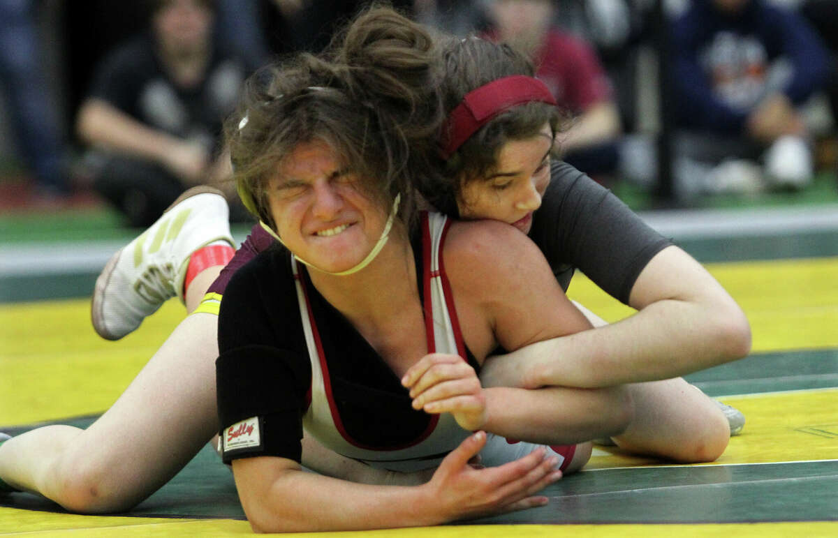 South Windsor's Valerie Turgeon, top, works to turnover Masuk's Gianna Silva during CIAC State Open Girls Wrestling championship action at Hillhouse High School in New Haven, Conn., on Saturday February 25, 2020.