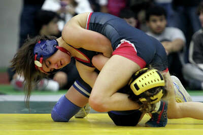 Avon wrestling claims Class M crown; Killingly wins Class S title