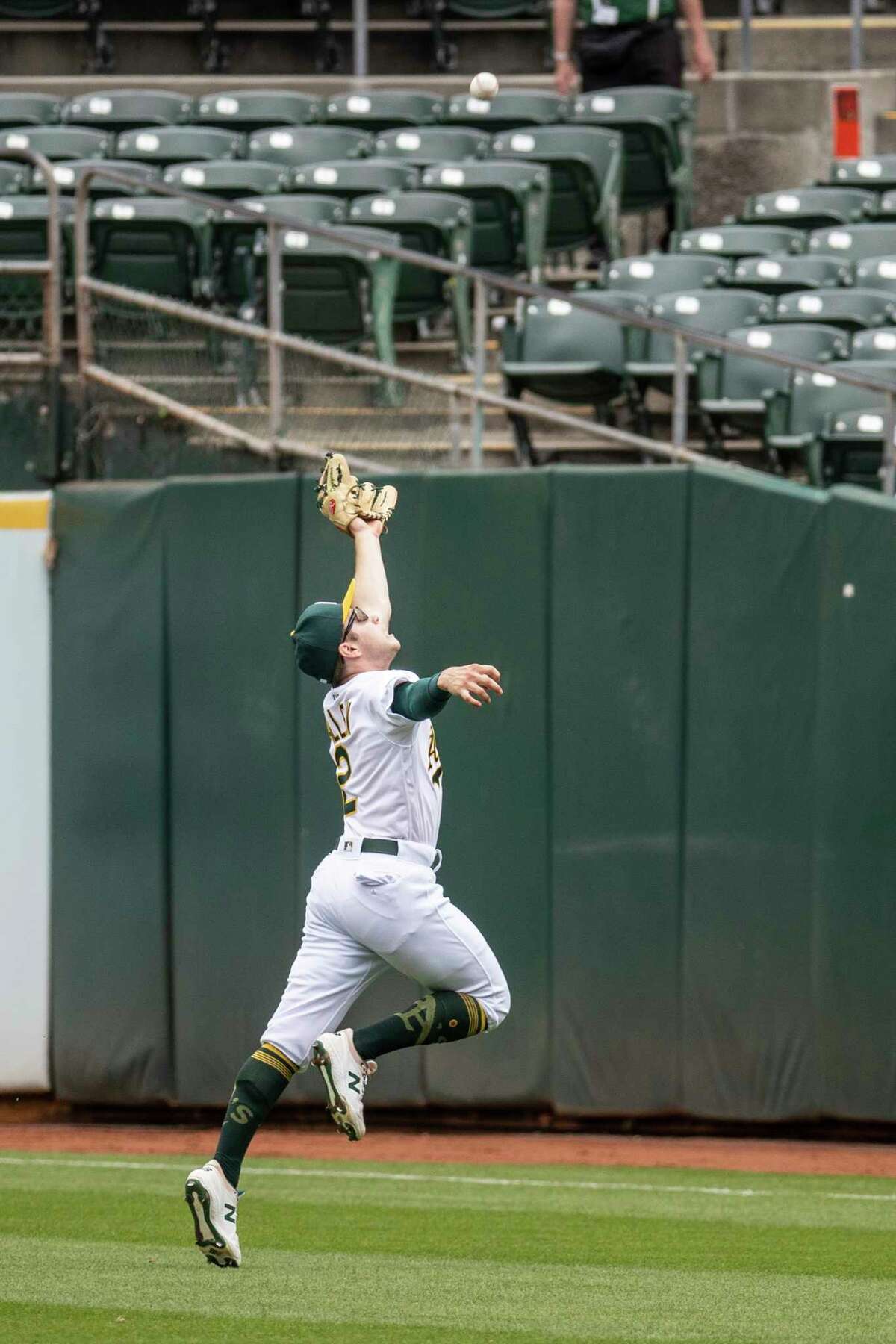 Nick Allen leaps to make a catch against the Toronto Blue Jays last season in Oakland.