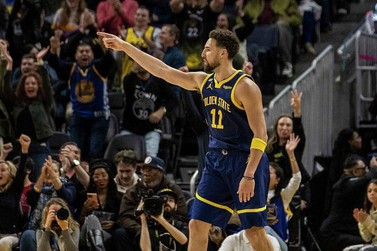 Golden State Warriors guard Klay Thompson (11) gestures after making a three point shot during the fourth quarter of his NBA basketball game against the Minnesota Timberwolves in San Francisco, Calif. Sunday, Feb. 26, 2023. The Warriors defeated the Timberwolves 109-104.