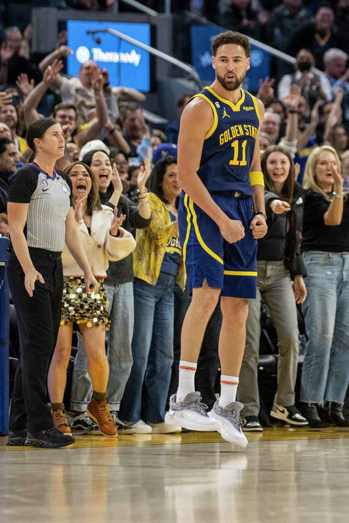 Golden State Warriors guard Klay Thompson (11) reacts after making a three point shot during the fourth quarter of his NBA basketball game against the Minnesota Timberwolves in San Francisco, Calif. Sunday, Feb. 26, 2023. The Warriors defeated the Timberwolves 109-104.
