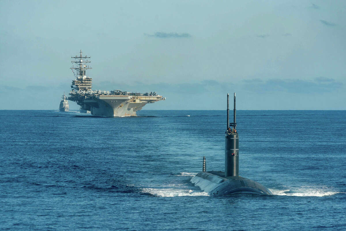 An unspecified Los Angeles-class fast-attack submarine out front of the USS Ronald Reagan and other ships off the Korean peninsula, in September 2022. (U.S. Navy photo by Mass Communication Specialist 3rd Class Gray Gibson)