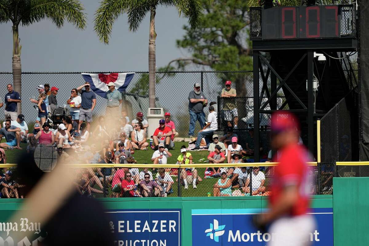The pitch clock winds down as Philadelphia Phillies pitcher Louis Head prepares to throw a pitch during the fourth inning of a spring training baseball game Saturday, Feb. 25, 2023, in Clearwater, Fla. (AP Photo/David J. Phillip)