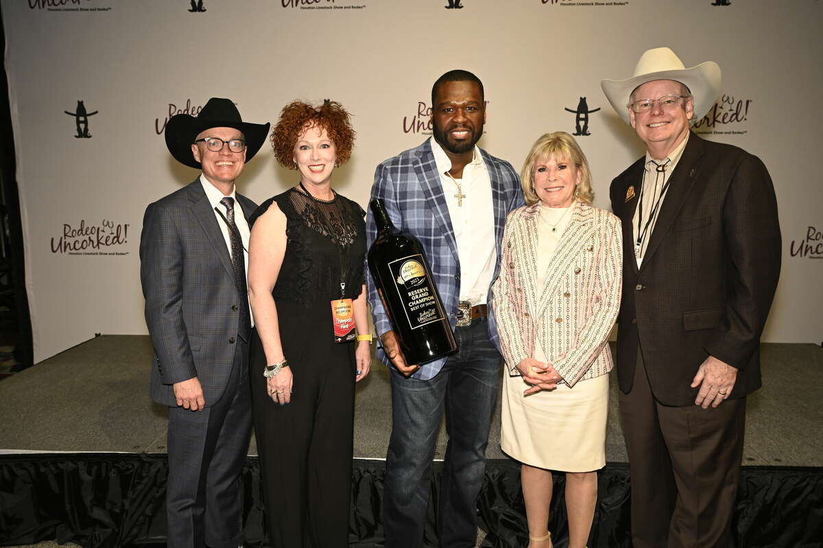 Curtis Jackson, better known as rapper 50 Cent, poses with a bottle of Bernhardt Winery Antiquity Chardonnay Reserve, Danube Plain, 2020. The wine won the 2023 Reserve Grand Champion Best of Show at the Houston Rodeo Uncorked! wine competition.