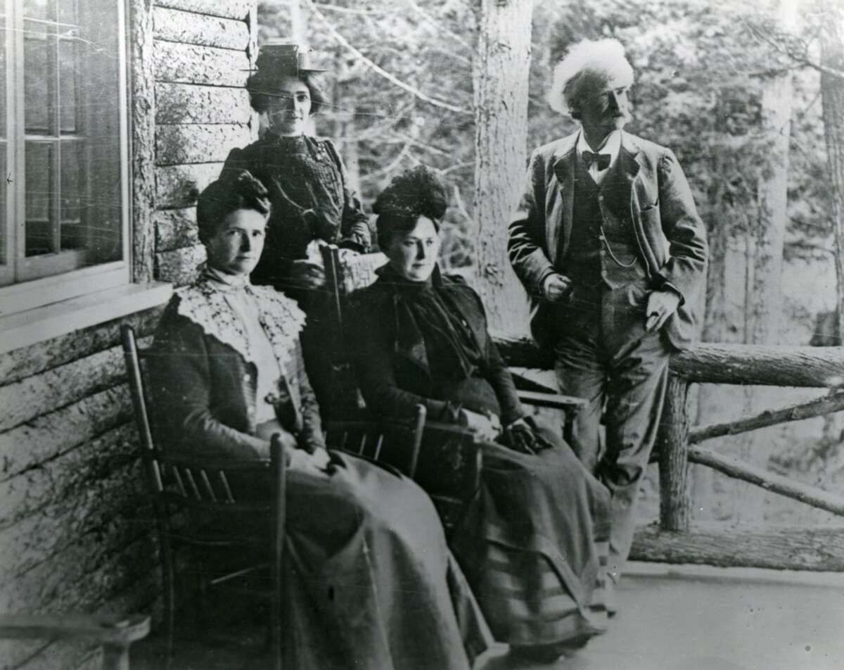 A brand-new exhibit at The Mark Twain House & Museum highlights the summer sojourns the author took between 1870 and 1906. Pictured, Samuel, Olivia, Clara, and Jean Clemens sit on the back porch of “The Lair” in the Adirondacks.