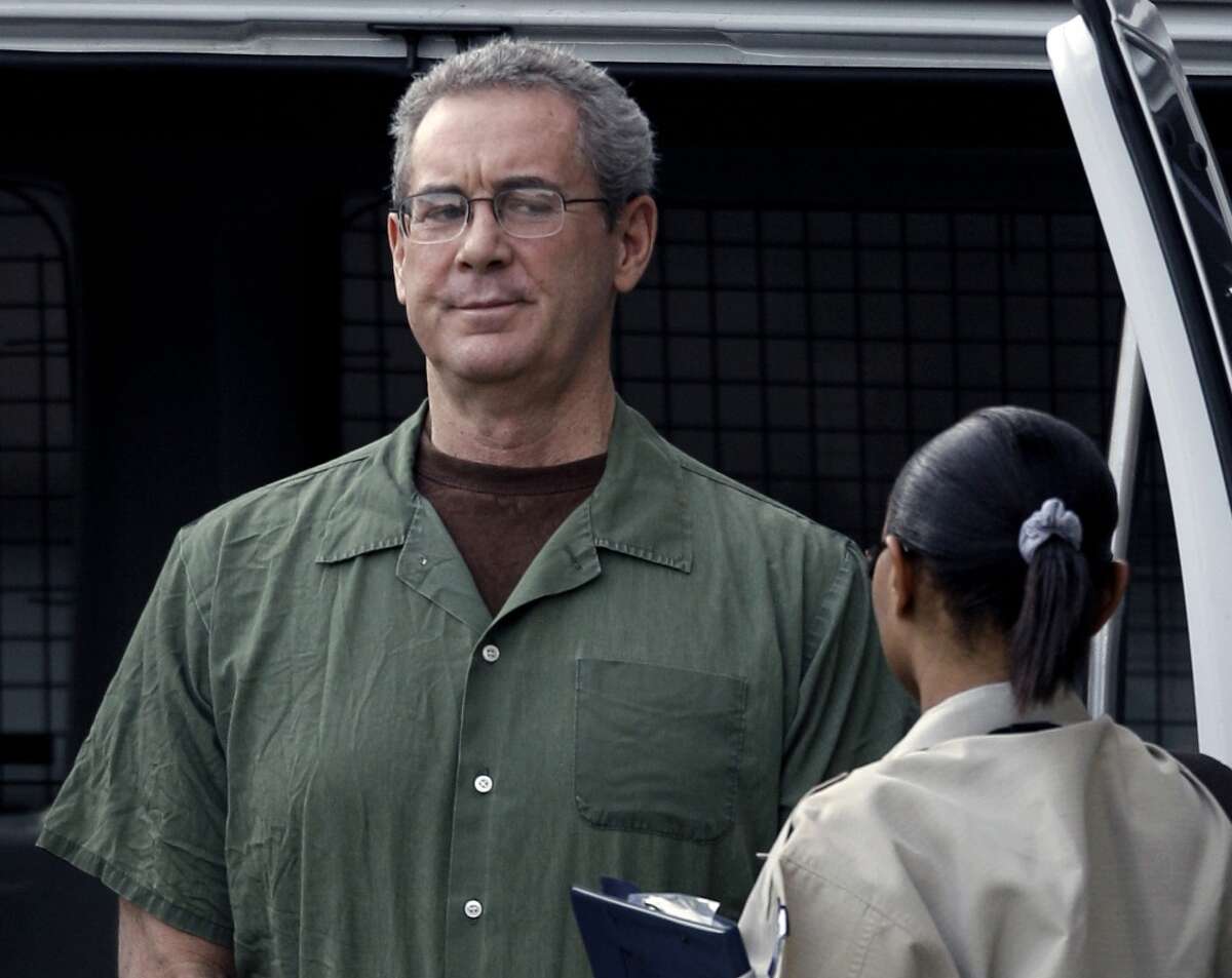 R. Allen Stanford arrives in custody at the federal courthouse for a hearing in Houston in 2010. Under agreements reached over the weekend, TD Bank will pay $1.205 billion, Independent Bank will pay $100 million, and HSBC Bank will pay $40 million to settle litigation related to the Stanford fraud.