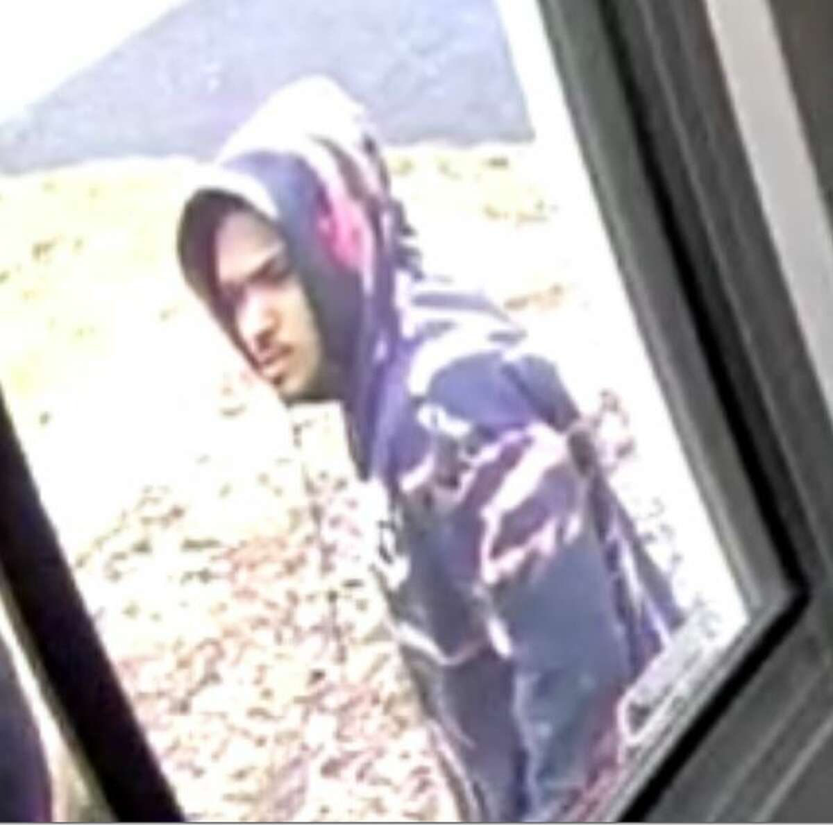 Manchester police release photos of man they say robbed and assaulted a FedEx delivery driver last week.