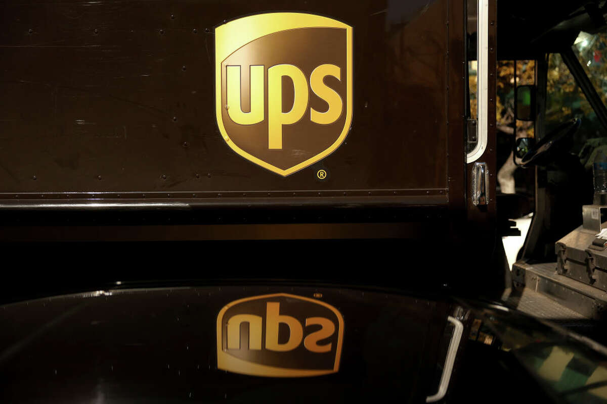 The United Parcel Service (UPS) logo is displayed on a delivery truck.