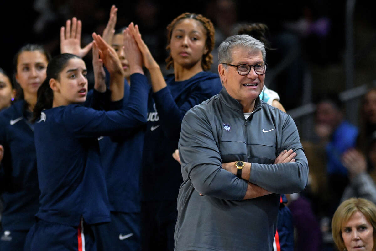 UConn head coach Geno Auriemma looks on as his team celebrates a Georgetown turnover during the second half of an NCAA college basketball game, Saturday, Feb. 11, 2023, in Washington. (AP Photo/Terrance Williams)