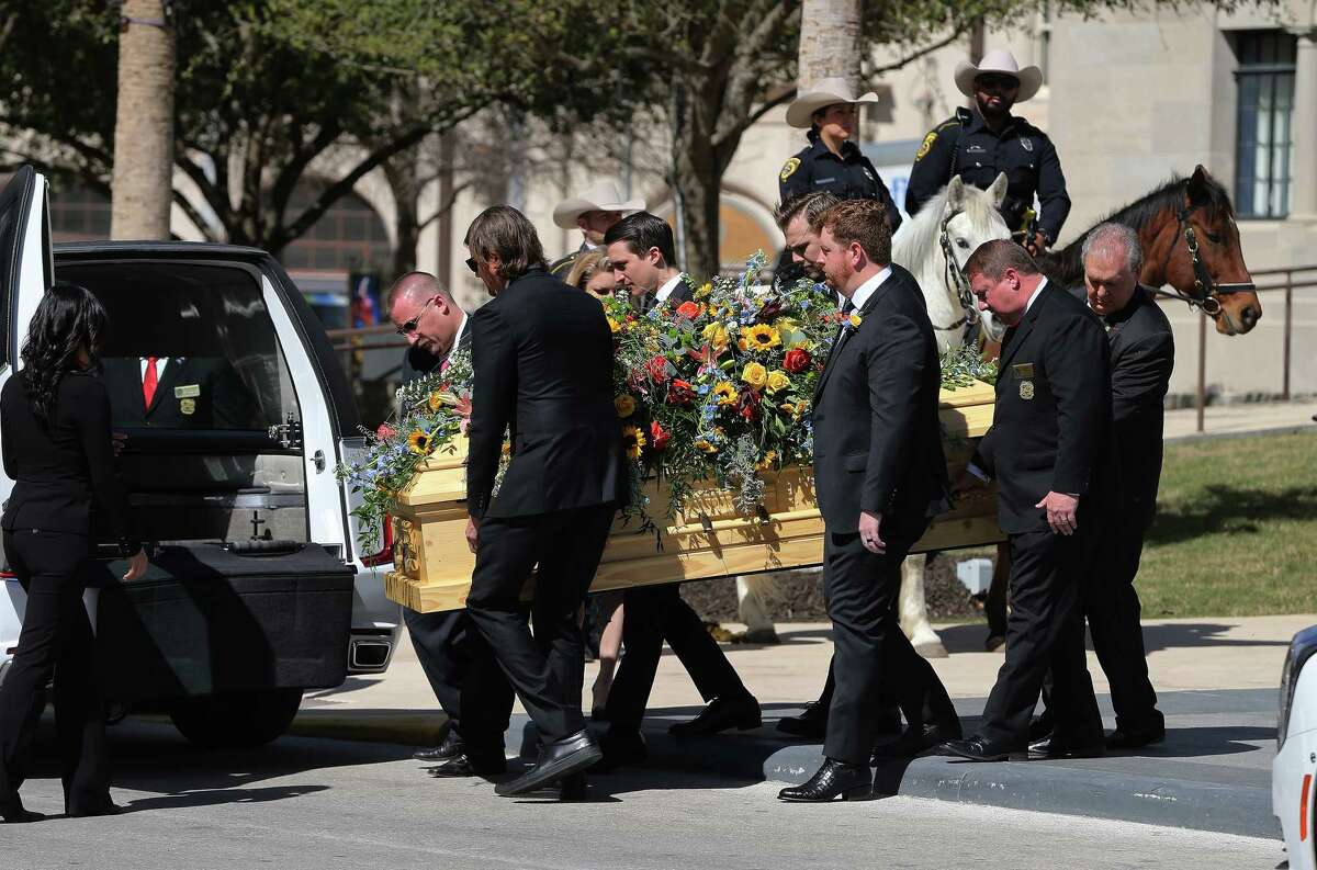 Family members carry the casket of B.J. “Red” McCombs toward the hearse as people gathered for the Red McCombs’ Celebration of Life memorial service at Tobin Center on Monday, Feb. 27, 2023.