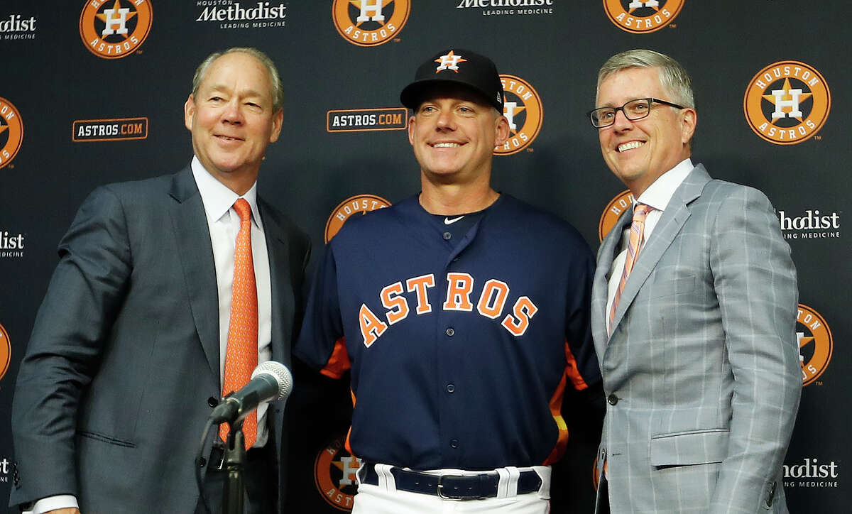Houston Astros owner Jim Crane, manager AJ Hinch and GM Jeff Luhnow during a press conference announcing Hinch's contract extension before the start of an MLB baseball game at Minute Maid Park, Thursday, August 30, 2018, in Houston.