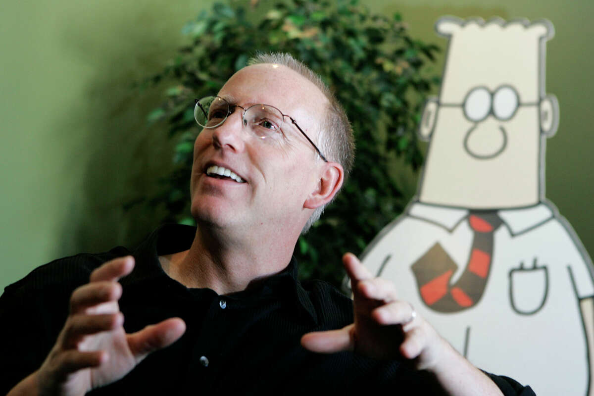 FILE - Scott Adams, creator of the comic strip Dilbert, talks about his work at his studio in Dublin, Calif., on Oct. 26, 2006. Adams experienced possibly the biggest repercussion of his recent comments about race when distributor Andrews McMeel Universal announced Sunday, Feb. 26 it would no longer work with the cartoonist. (AP Photo/Marcio Jose Sanchez, File)
