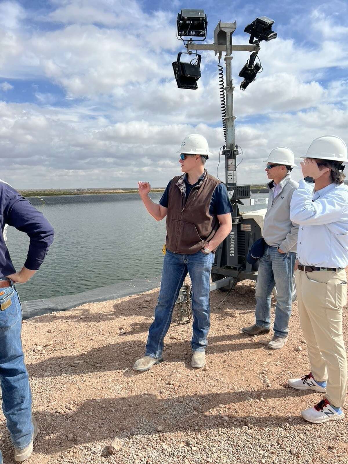 Infinity Water Solutions President and Chief Financial Officer Chris Caudill inspects the company's Mills Ranch facility in Eddy County, New Mexico.
