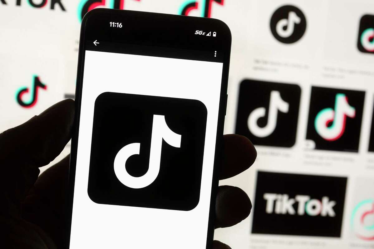 FILE - The TikTok logo is seen on a cell phone on Oct. 14, 2022, in Boston. The White House is giving all federal agencies 30 days to wipe TikTok off all government devices, as the Chinese-owned social media app comes under increasing scrutiny in Washington over security concerns.