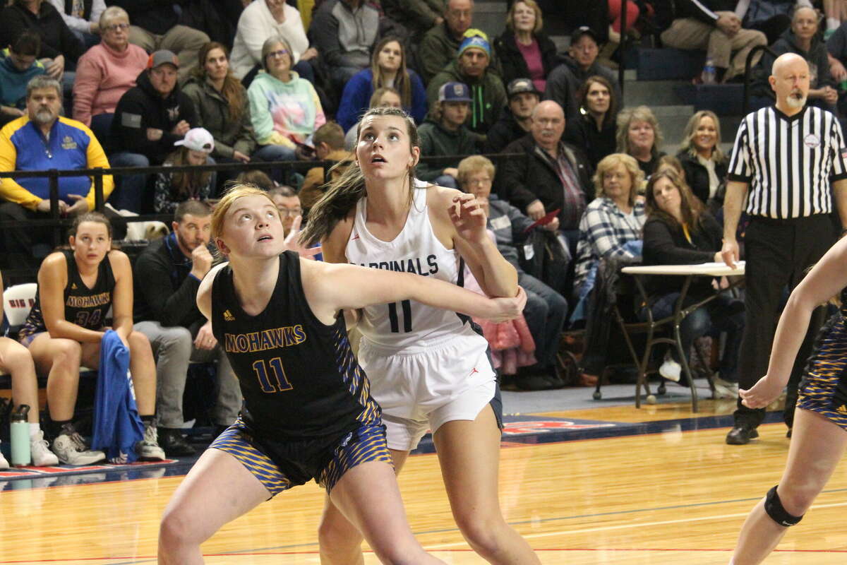 Morley Stanwood's Olivia Nelson (left) gets set to battle Big Rapids' Julia Waltz for a possible rebound during a February game.