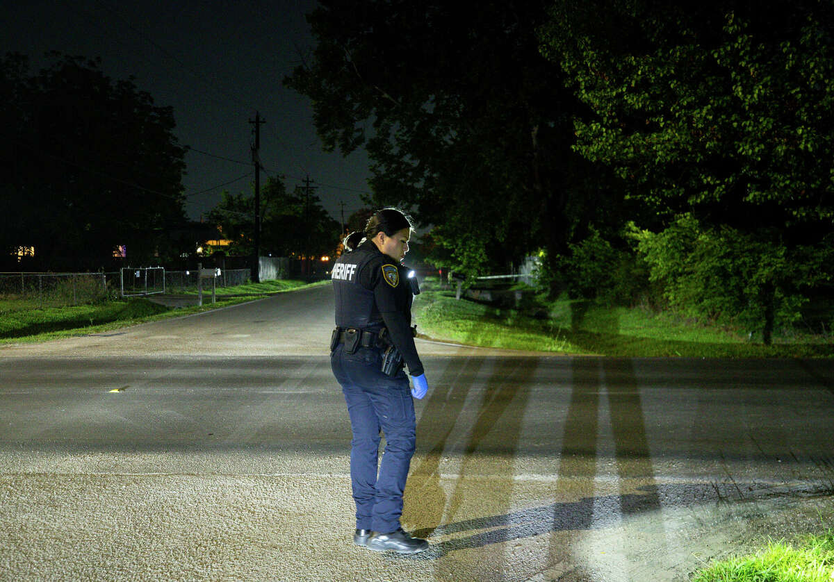Harris County Sheriffs Office deputy Jessica Suarez scans the road in search of the six gunshots reported by a ShotSpotter call in Houston.