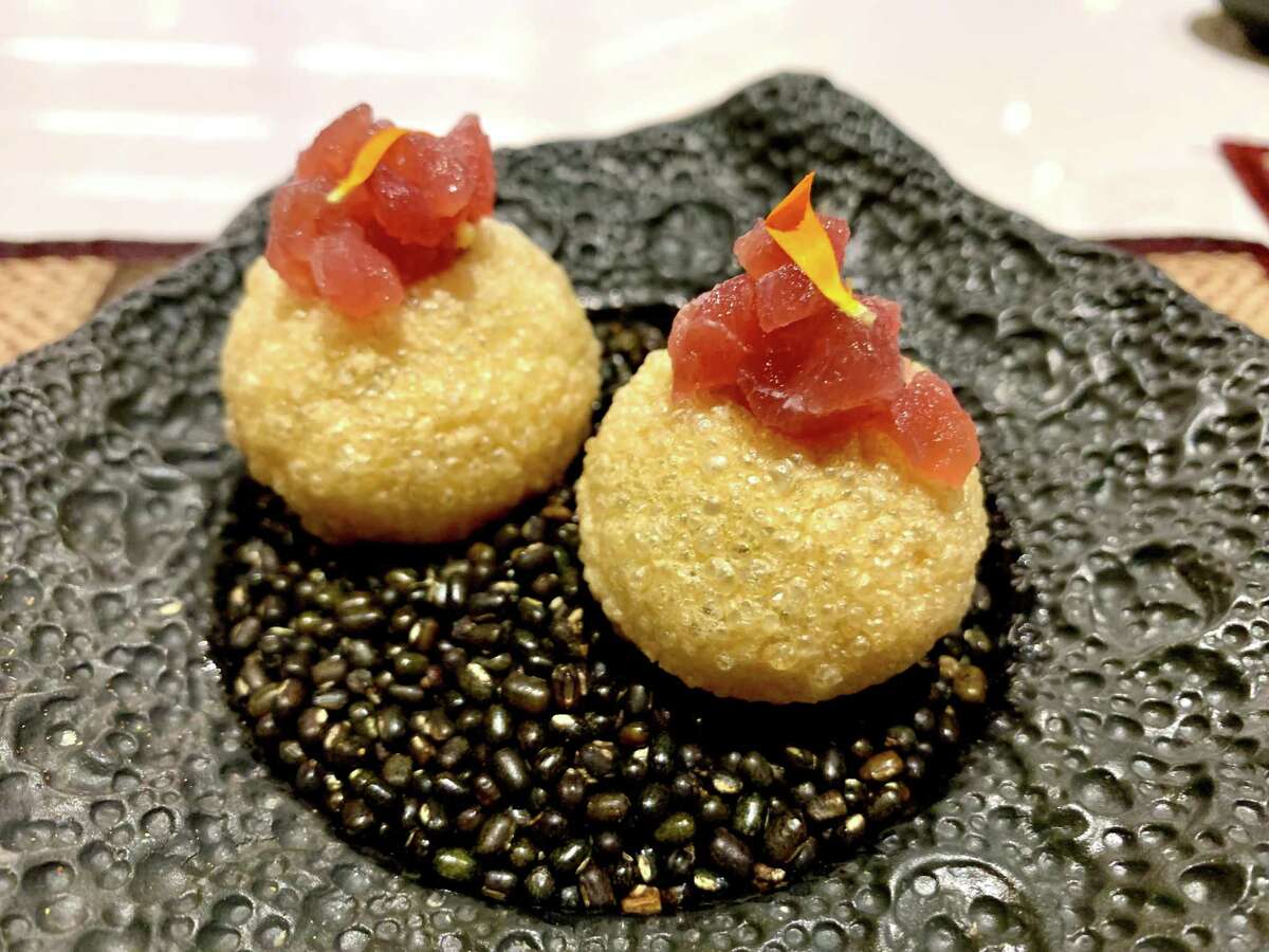 Golgappa with tuna set on a bed of uncooked black lentils at Amrina contemporary Indian restaurant in The Woodlands