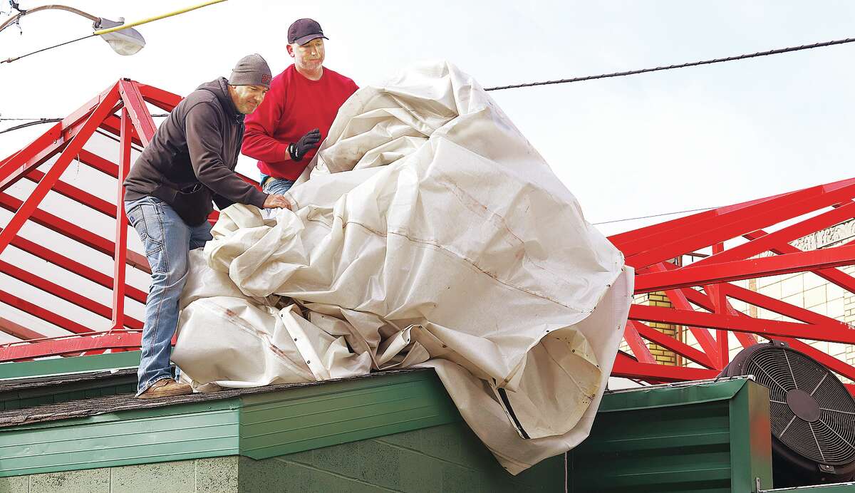 Spring must be close, since workers were removing the winter tarp from the outdoor area at Fast Eddie's Bon Air Tuesday morning. Wednesday marks the first day of March, with the first official day of spring on March 20.