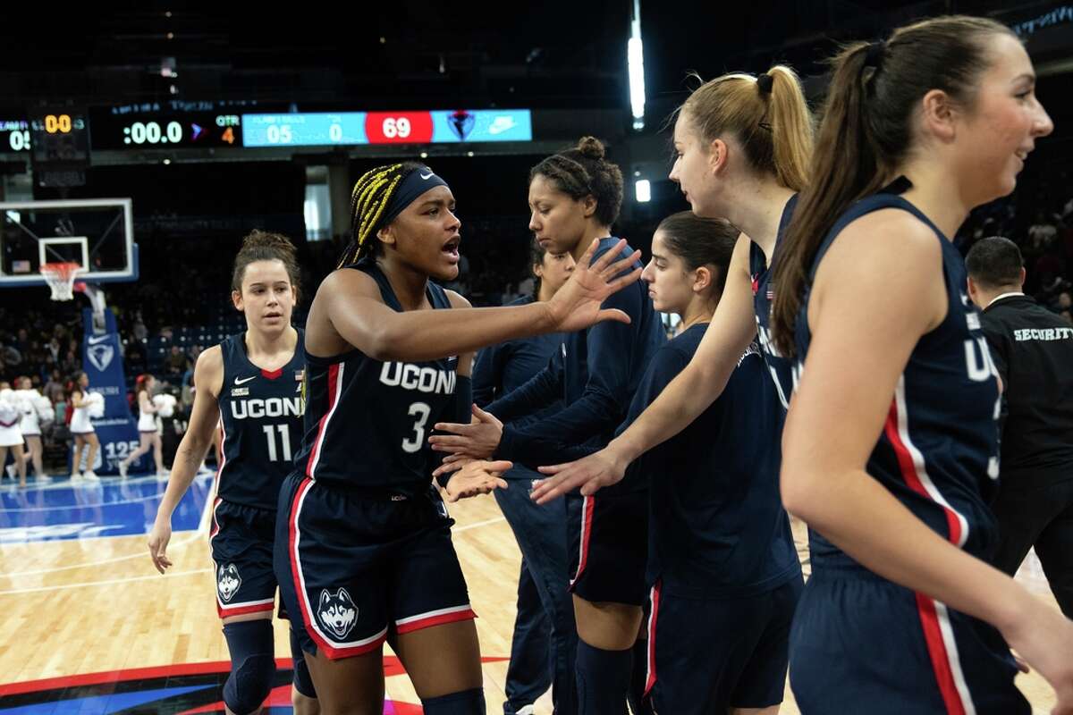 UConn forward Aaliyah Edwards, left, celebrates a 72-69 win over DePaul after the second half of an NCAA college basketball game Saturday, Feb. 25, 2023, in Chicago. (AP Photo/Erin Hooley)