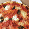 The Bufala Margherita at Dough is topped with slivers of basil and olive oil.
