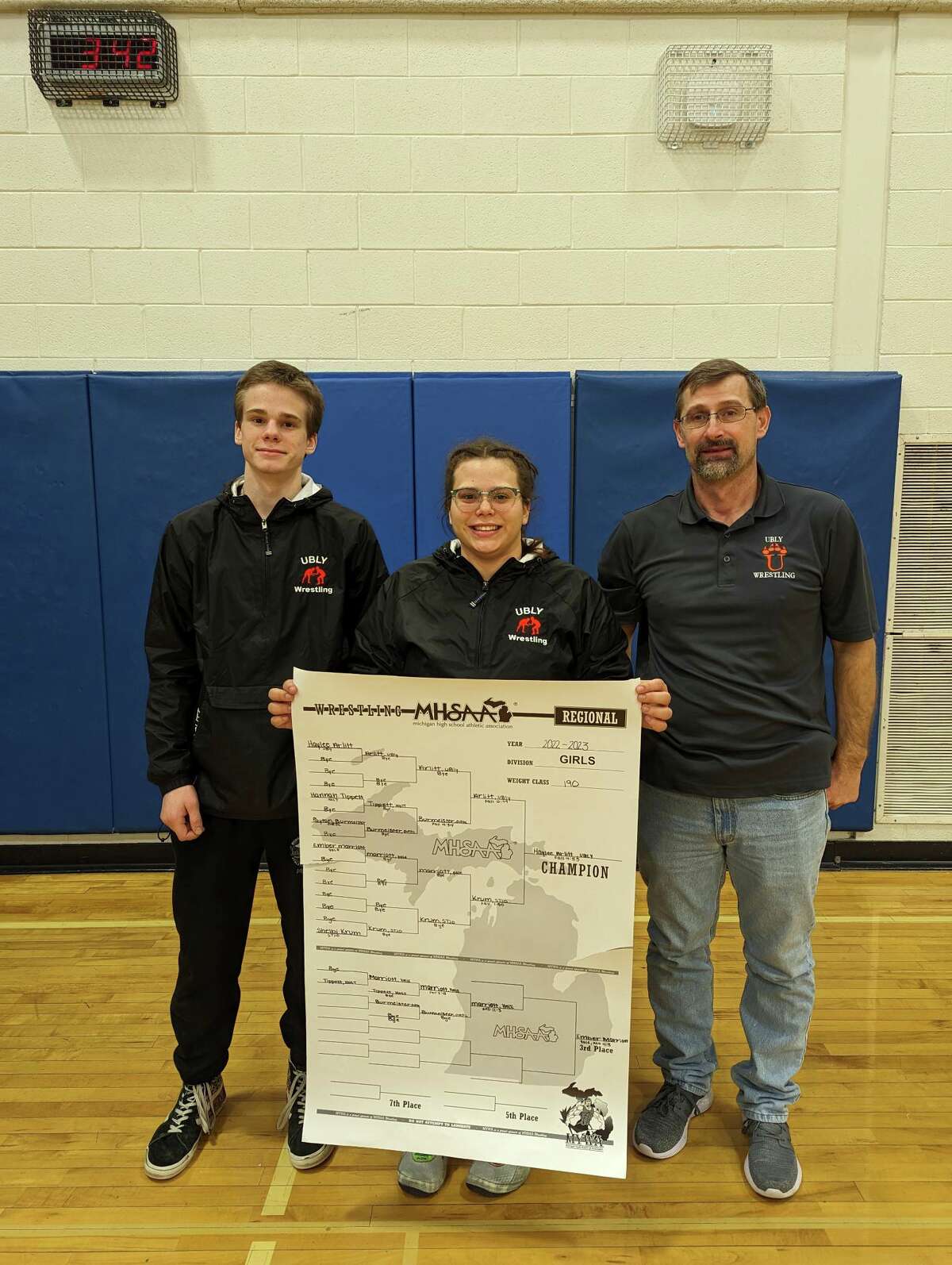 Ubly's Haylee and Chris Arlitt with coach Keith Mausolf.