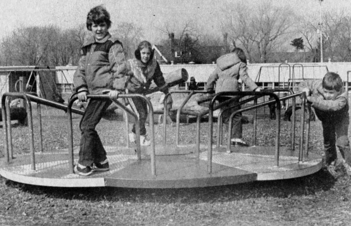 Children at Central Elementary enjoyed yesterday's spring-like weather as they romped on the playground. The photo was published in the News Advocate on March 2, 1983.