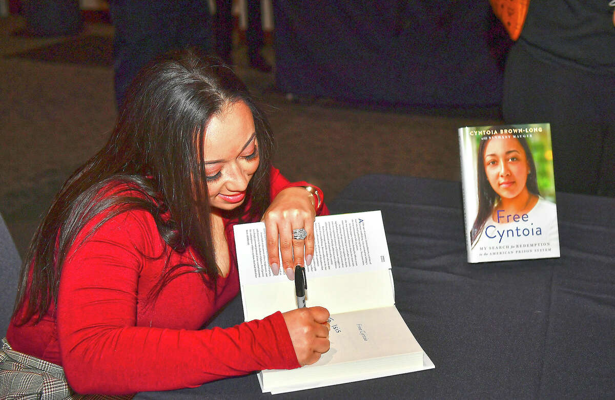 Author Cyntoia Brown Long signs copies her new book "Free Cyntoia: My Search for Redemption in the American Prison System." She will share her story in April at Blackburn College.