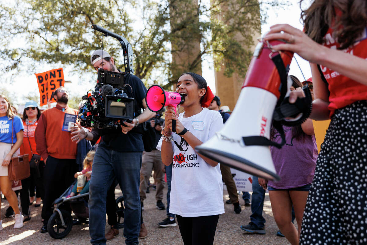 "What do we want? Justice. When do we want it? now," shouts 10-year-old Caitlyne Gonzales, center, as she helps lead Texans marching from First Baptist Church of Austin to the Capitol building in Austin, Texas, Tuesday, Feb. 28, 2023.