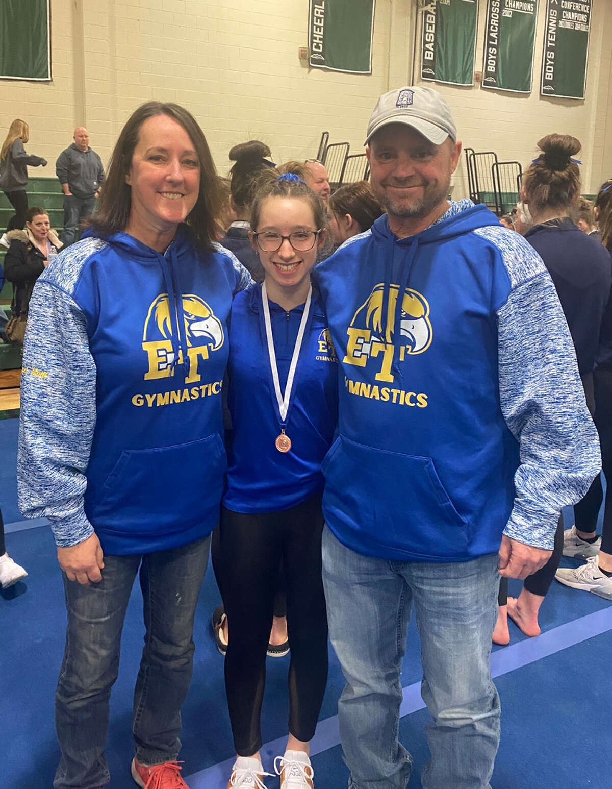 Michelle Murray and Tim Murray with daughter, Jordyn Murray, a sophomore gymnast for Ellis Tech who will compete in the CIAC State Open.