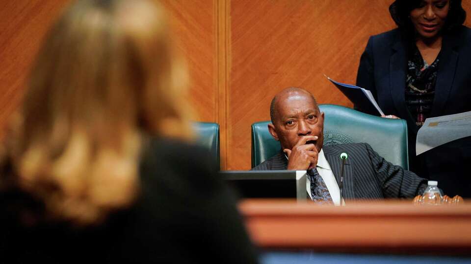 Houston Mayor Sylvester Turner speaks with Christina Pappas, director of marketing for Pappas Restaurants, during a testy exchange about an airport vendor contract for Hobby Airport on Tuesday, Feb. 28, 2023, at Houston City Hall in Houston.