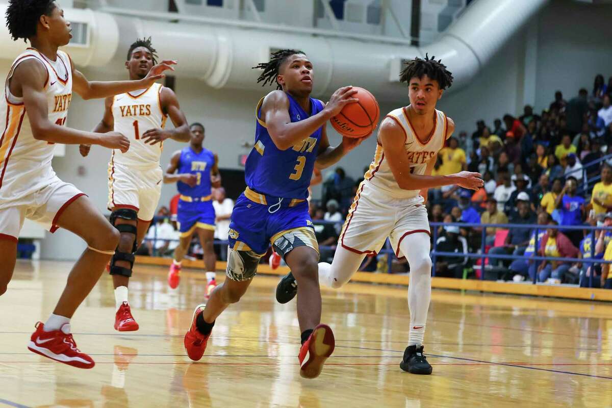 Washington’s Odis Carter, Jr. (3) drives down court in the first half of a Region III-4A quarterfinal boys basketball game between the Yates Lions and the Washington Eagles at Butler Fieldhouse in Houston, TX on Tuesday, February 28, 2023.
