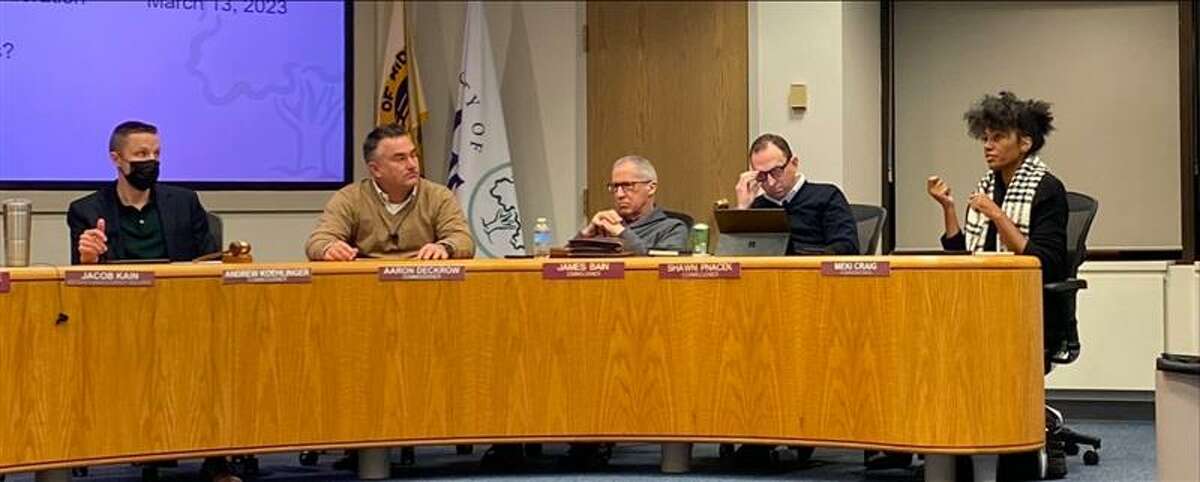 Commissioner Meki Craig (far right) discusses an aspect of the Capital Improvement Plan with her fellow commissioners, from left, Chair Andrew Koehlinger, commissioners Aaron Deckrow, James Bain Jr., and Shawn Pnacek at the planning commission meeting on Feb. 28, 2023 at Midland City Hall. 