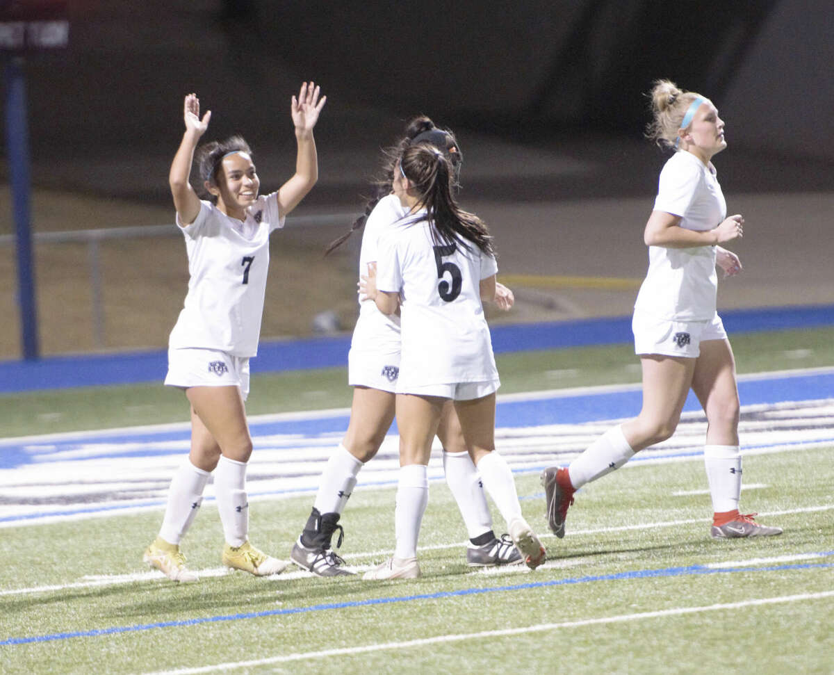 Odessa Permian's Anai Lopez (7) raises her arms in excitement after scoring a goal against Legacy, Feb. 28 at Astound Broadband Stadium. 