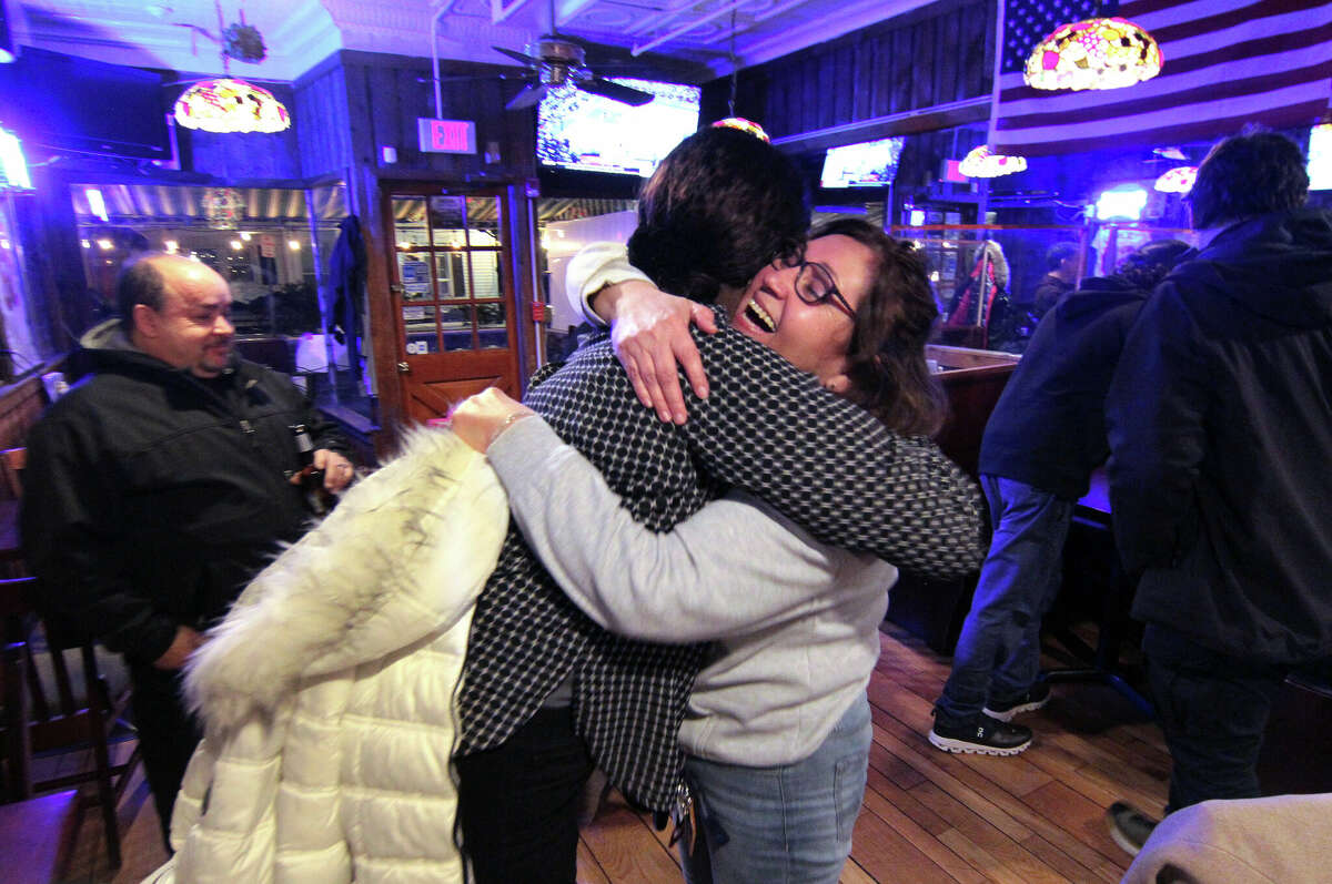 Democratic candidate Anabel Figueroa receives a hug from state Senator Patricia Billie Miller at Murphy's Townhouse Café in Stamford, Conn., on Tuesday February 28, 2023. Figueroa defeated Republican candidate Olga Anastos for the 148th District seat in the state House in a special election.