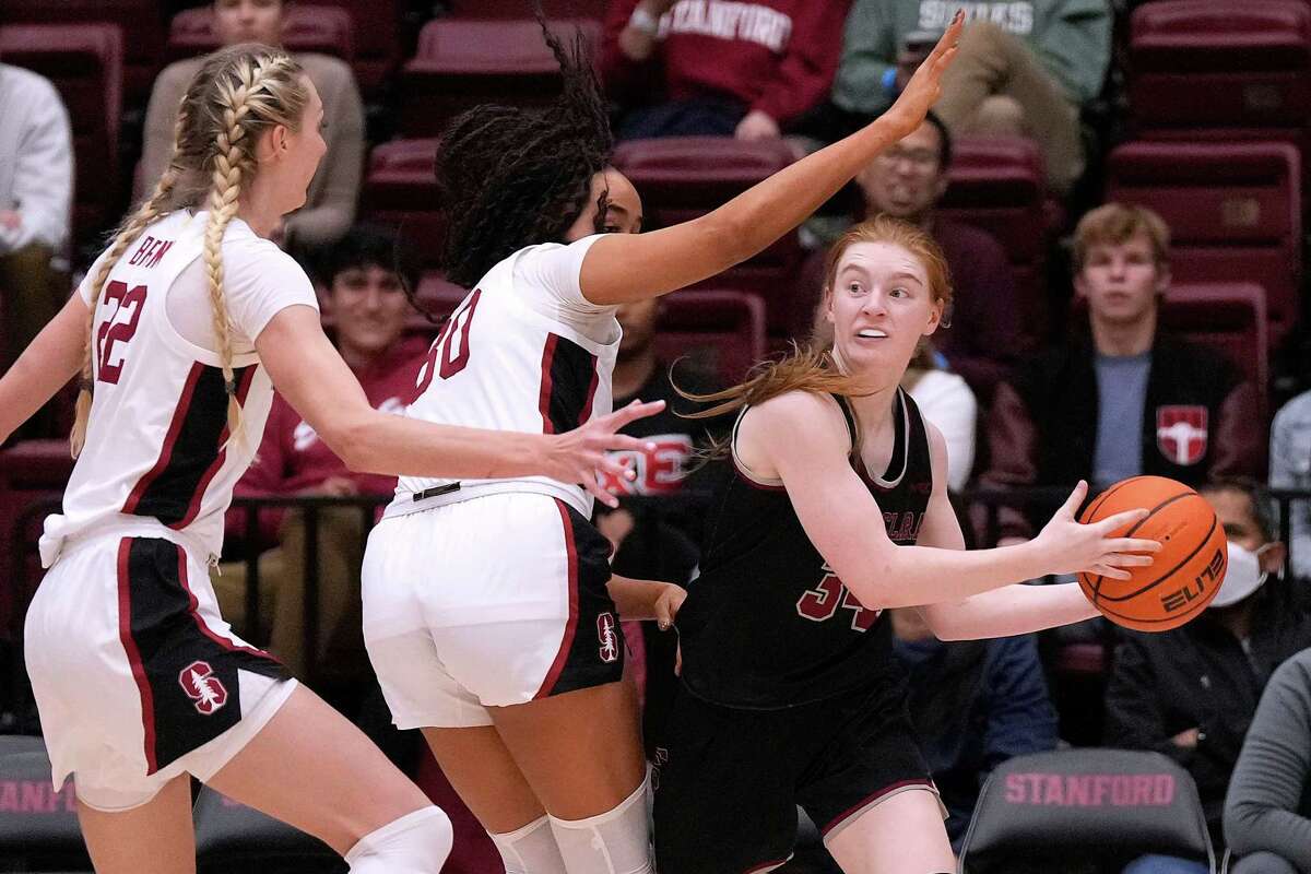 Santa Clara guard Tess Heal (34) looks to past against Stanford’s Haley Jones (30) and Cameron Brink (22) during the second half at Stanford Maples Pavilion on Nov. 30, 2022 in Palo Alto, California. Stanford won 82-69.
