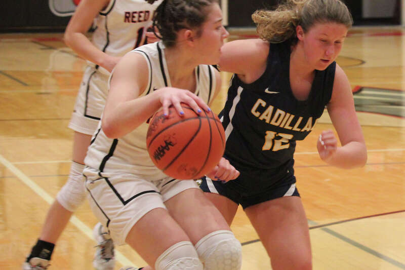 Reed City's Casey Terryn goes to the basket against Cadillac on Tuesday.